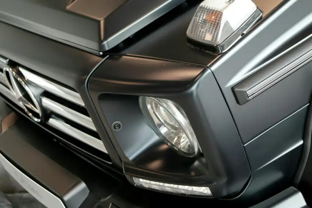 a close up image of luxury car head lights