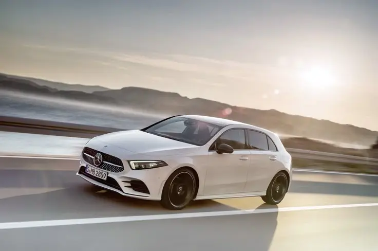 an image of a white A-Class Hatchback moving on the road