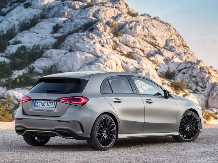 an image of a Mercedes Hatchback with a hell in the background