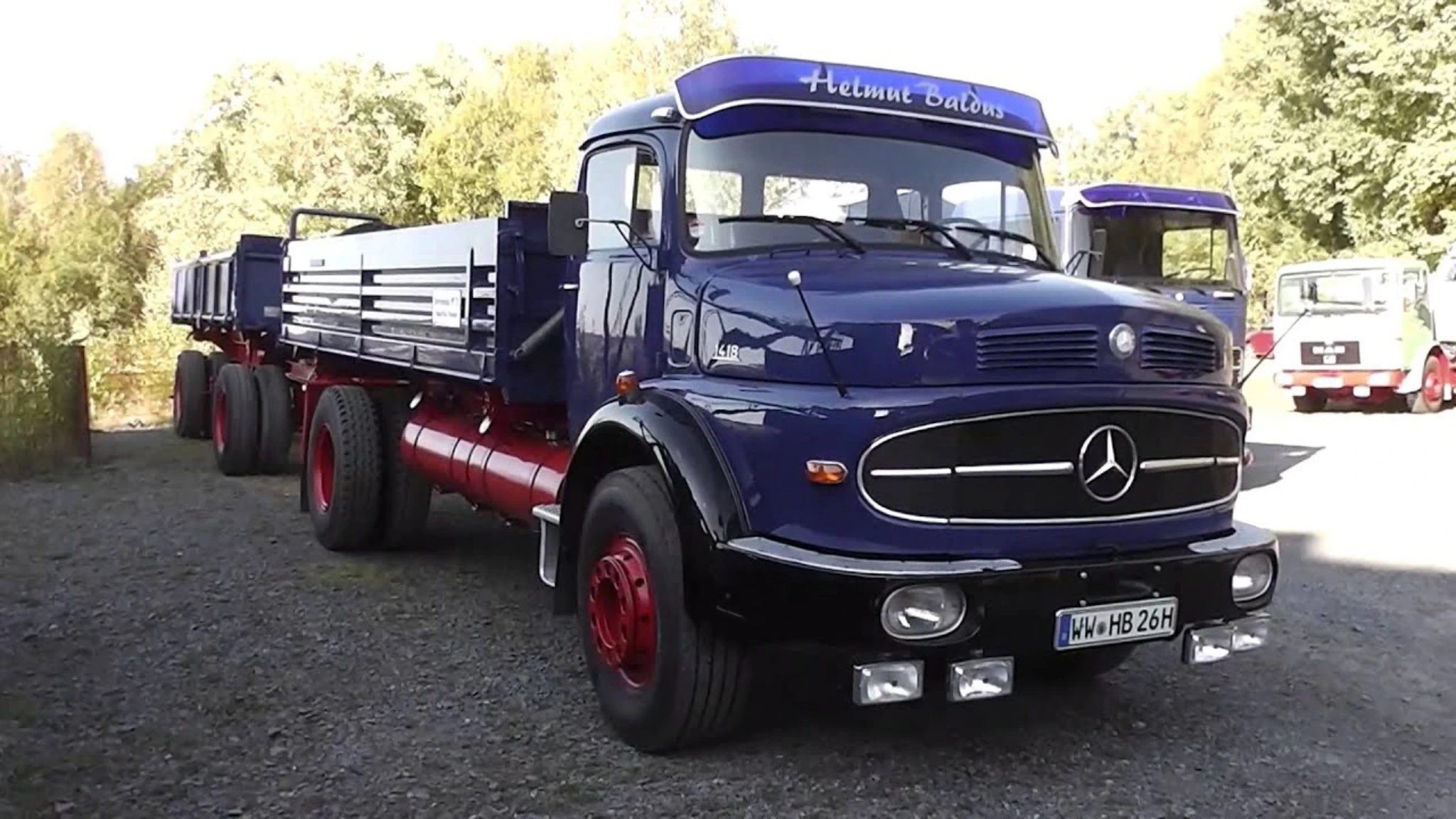 an image showing a blue mercedes benz lorry