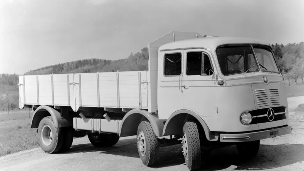an image showing a white mercedes benz lorry