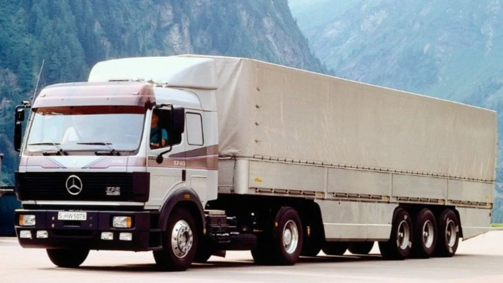 an image showing a white mercedes benz lorry