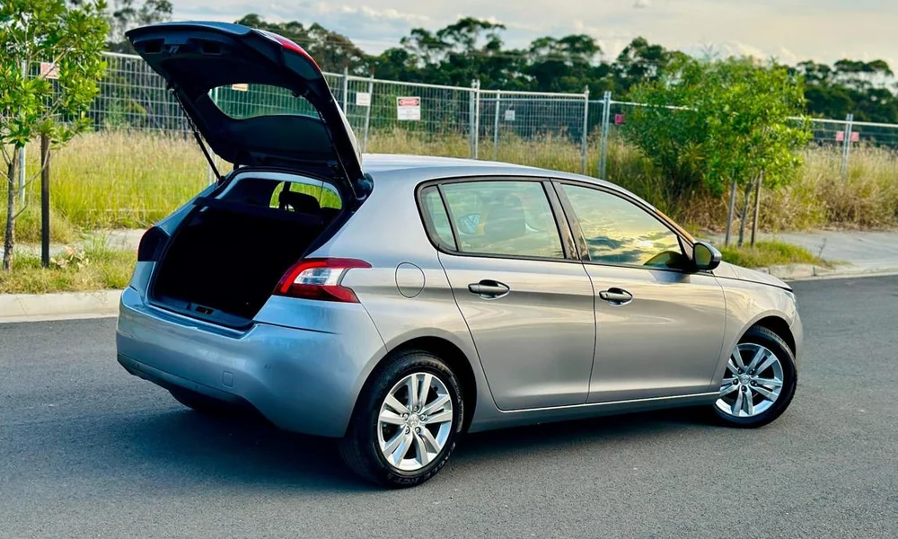 Compact hatchback car showing its rear hatch and cargo access.