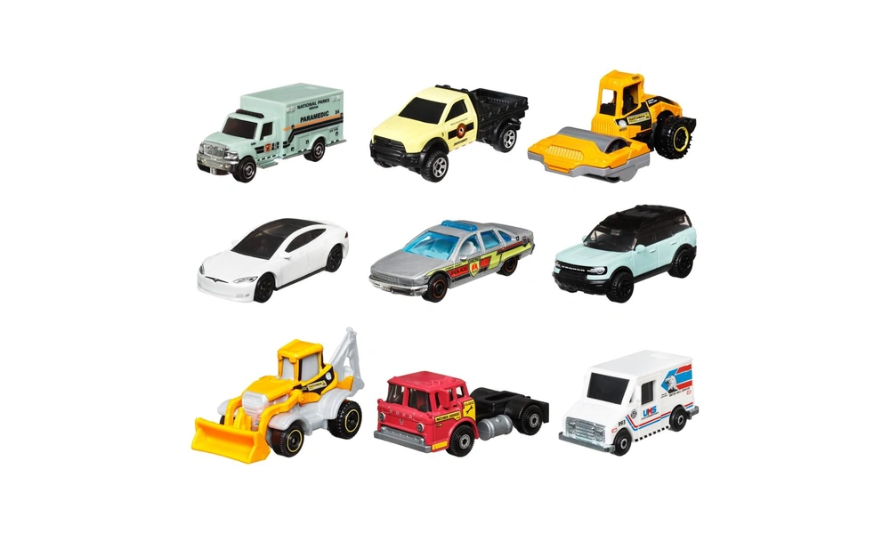Matchbox-style miniature fire engine, ambulance, police vehicle, and construction truck.