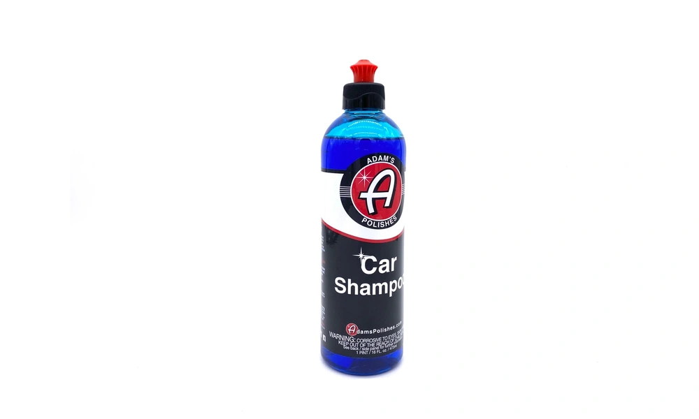 Bottle of Adam's Car Shampoo with a blue formula and red cap