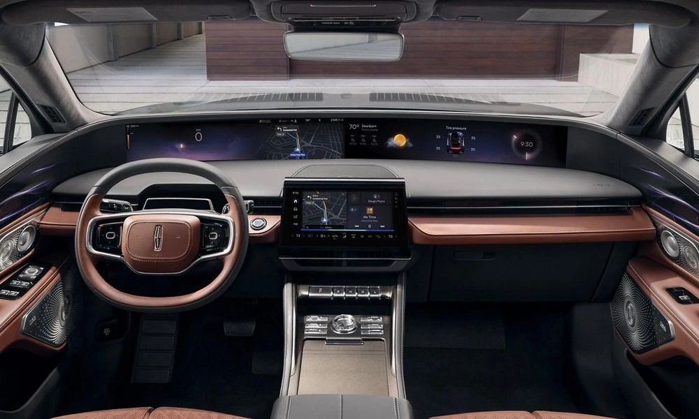 Luxury SUV interior with leather seats, dashboard display, and center touchscreen.