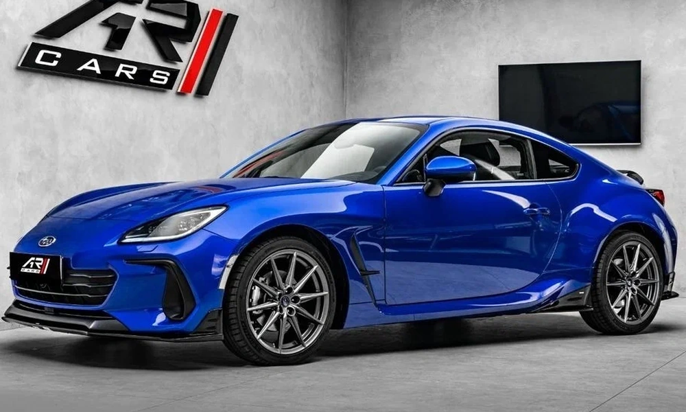 Blue Subaru BRZ rear-wheel-drive sports coupe in a showroom