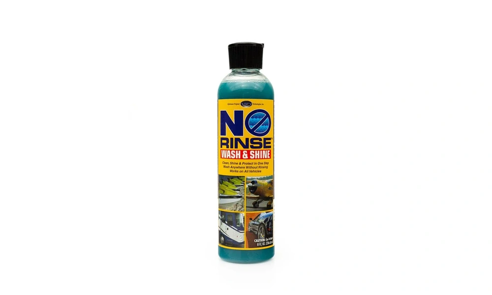 Bottle of Optimum No Rinse Wash & Shine with a teal formula