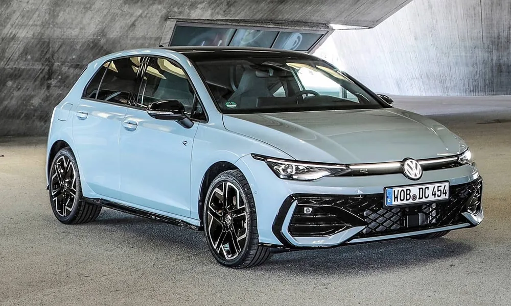 Light blue Volkswagen Golf hatchback with black alloy wheels parked in a concrete garage