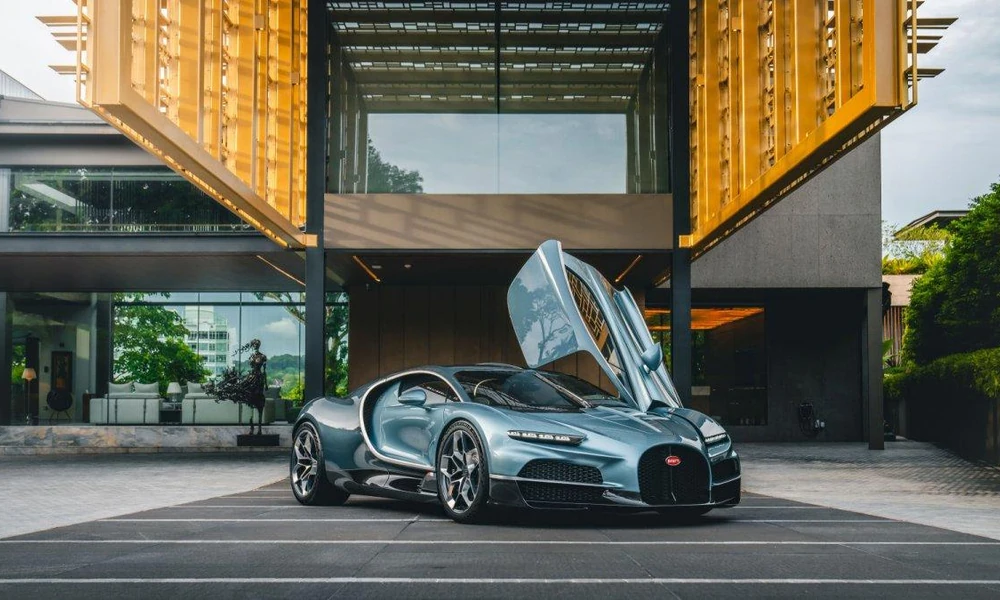 Exotic supercar parked outside a modern building.