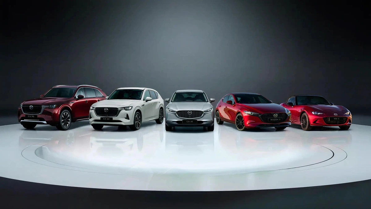 Mazda sedan, SUVs, and sports car parked together outdoors.