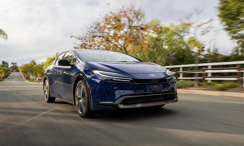 Modern hybrid car driving on a suburban road-Types of cars
