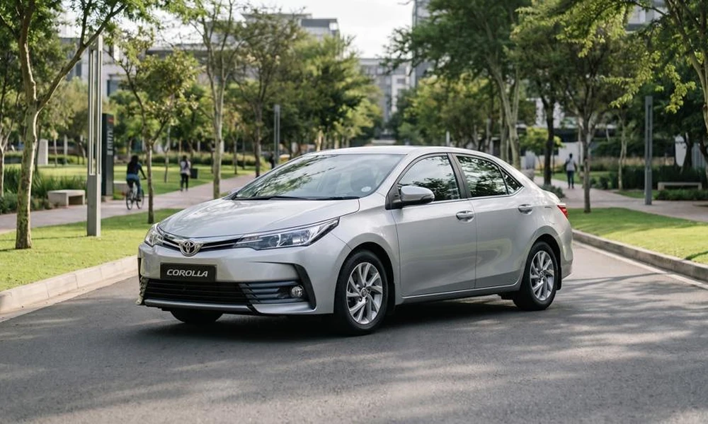 Silver compact sedan parked on an urban street.
