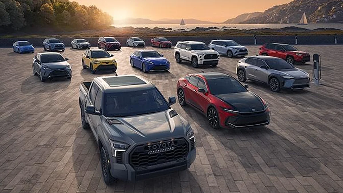Modern lineup of sedans, SUVs, and electric cars in an outdoor setting.