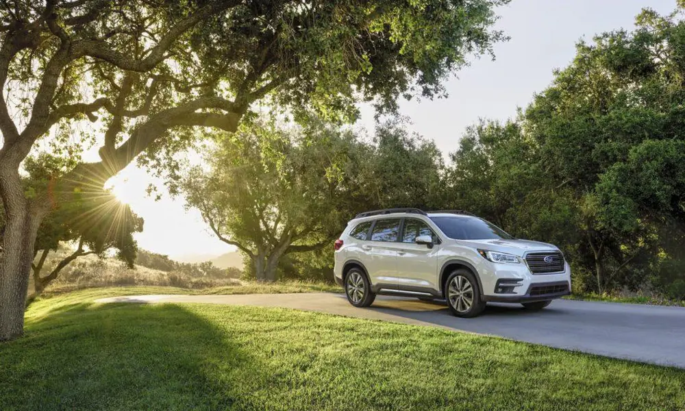 Modern family SUV parked beside a scenic road.