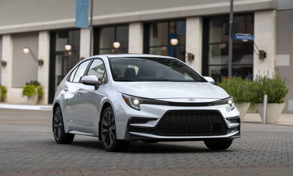 Silver Toyota Corolla sedan showing its front exterior design.