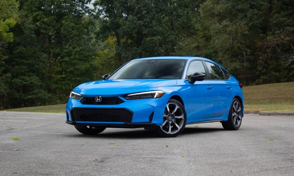 Blue Honda Civic sedan parked outdoors showing its modern exterior design.