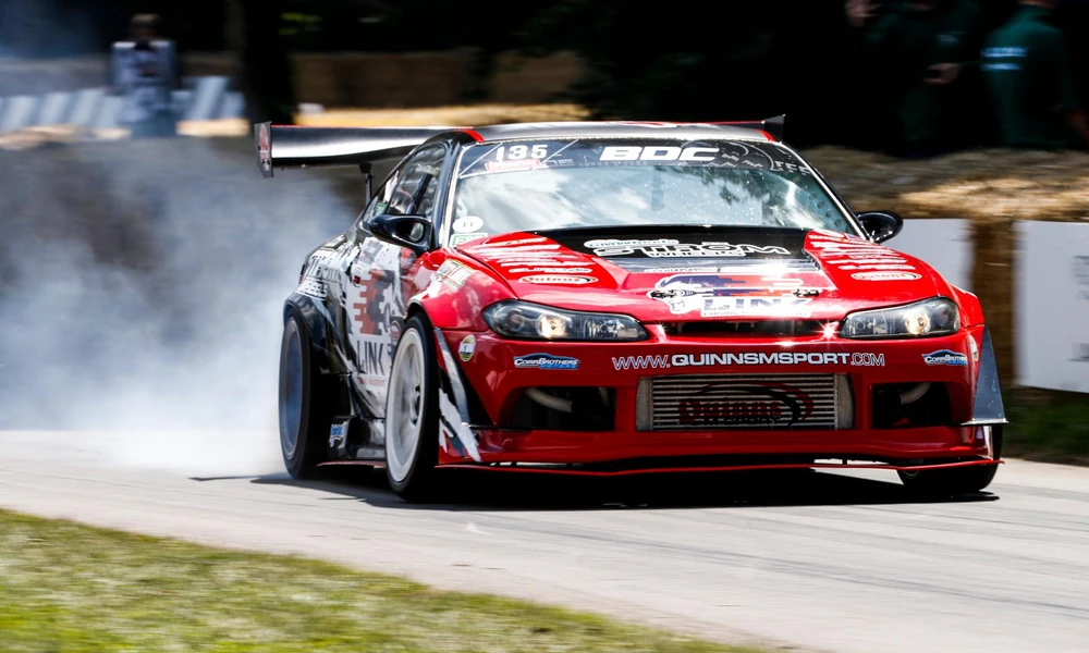 Modified Nissan Silvia S15 drift car at a motorsport event.
