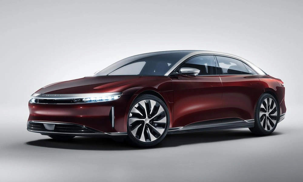 Red Lucid Air Grand Touring luxury electric sedan with an aerodynamic exterior.