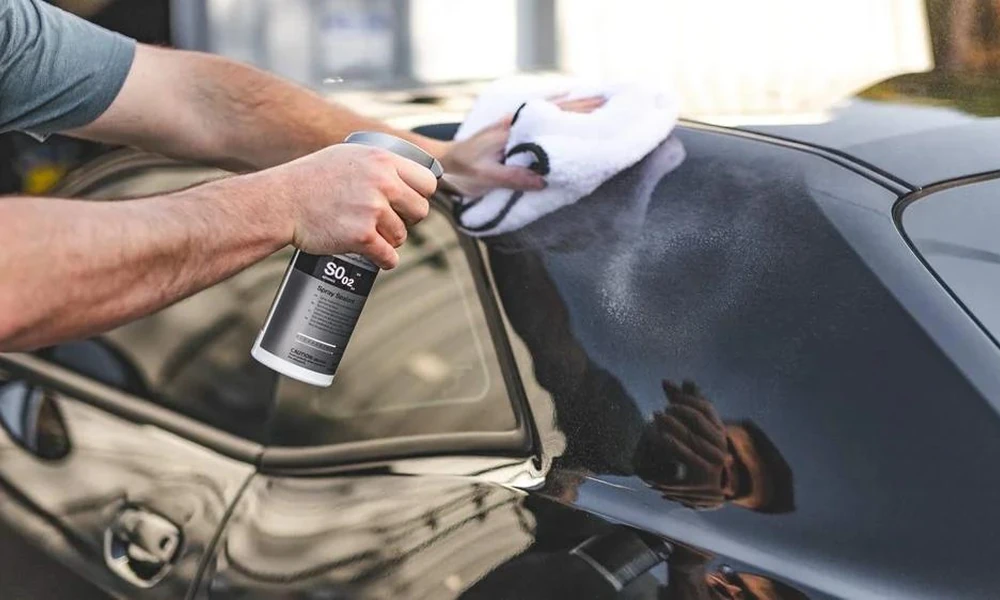 Ceramic spray coating applied to car paint during vehicle detailing