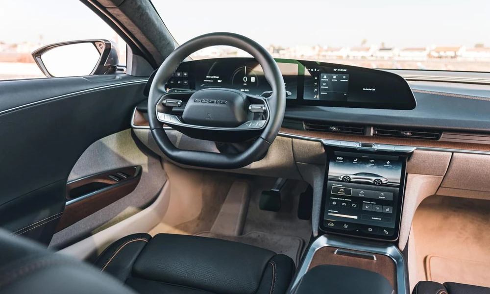 Lucid Air electric sedan interior showing the dashboard, touchscreen, and front seats.