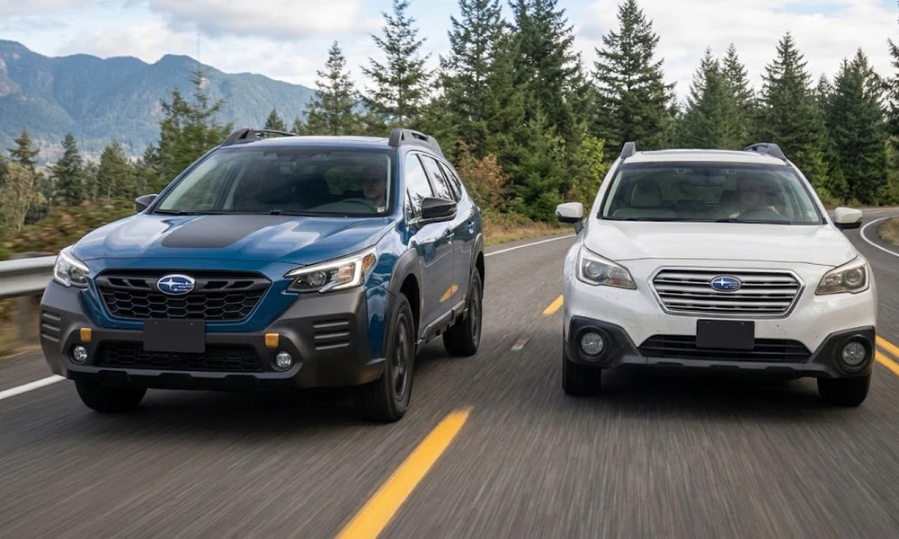 New vs. Used Subaru Cars: a blue newer Subaru Outback and a white older Subaru Outback driving side by side on a mountain road