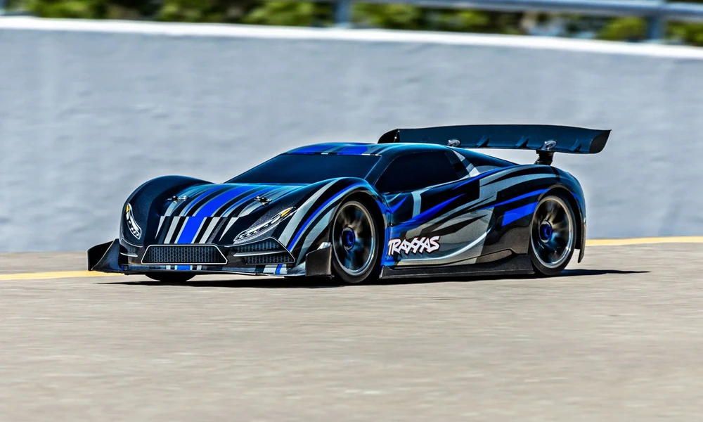 Traxxas XO-1 high-speed RC supercar on an empty paved road