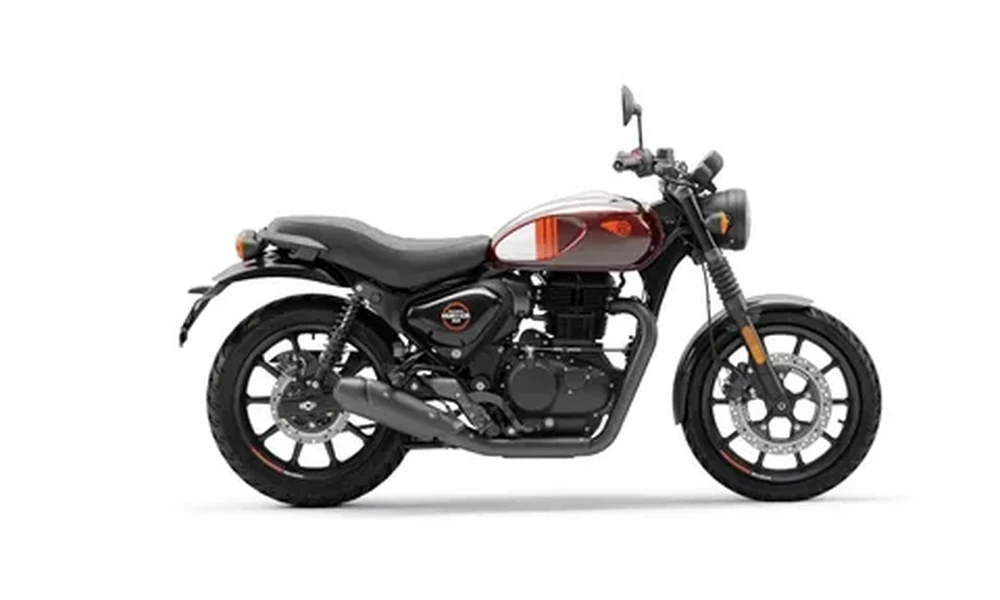 Red and silver Royal Enfield Hunter 350 retro roadster motorcycle with black seat and alloy wheels, side view on a white background