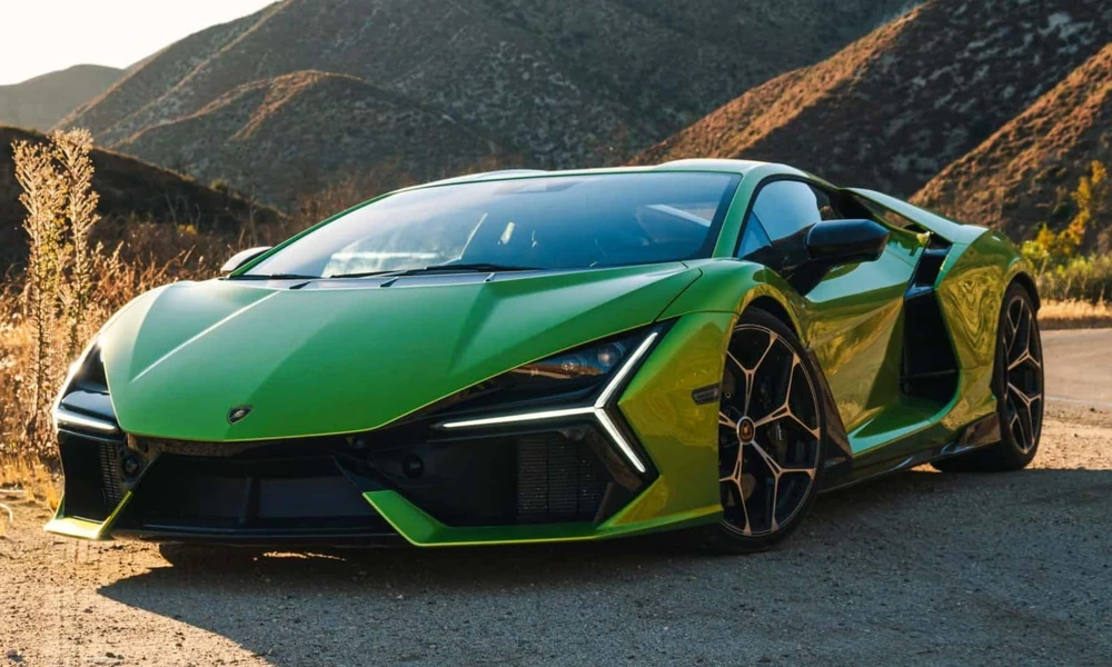 Green Lamborghini Revuelto photographed outdoors.